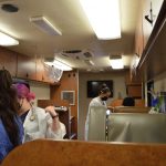 We Are Blood staff Inside the bloodmobile preparing to draw blood from doors. (Photo: Maggy Wolanske, Reporting Texas TV)