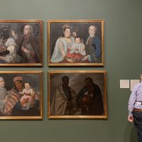 A visitor looks at casta paintings on display at the Blanton Museum of Art in Austin, Texas, on Oct. 22, 2022. (Photo: Oihane Ochoa, Reporting Texas TV)