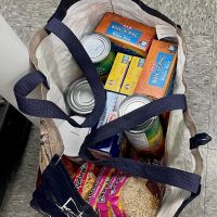 A student shops for groceries at the UT Outpost pantry, on Shopping bag of a student at the UT Outpost pantry in Austin, Texas, on Wednesday, Nov. 30, 2022. (Photo: Oihane Ochoa Navarro, Reporting Texas TV)