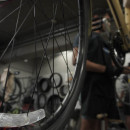 Rishi Thakkar works on a daily rental bike at the Orange Bike Project in Austin, Texas, on Oct. 2, 2023, (Mariela Villela/Reporting Texas TV)