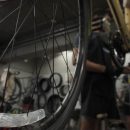 Rishi Thakkar works on a daily rental bike at the Orange Bike Project in Austin, Texas, on Oct. 2, 2023, (Mariela Villela/Reporting Texas TV)