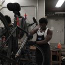 Samuel Olatunbosun works on a daily rental bike at the Orange Bike Project in Austin, Texas, on Oct. 2, 2023, (Mariela Villela/Reporting Texas TV)