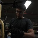Rishi Thakkar works on a daily rental bike at the Orange Bike Project in Austin, Texas, on Oct. 2, 2023, (Mariela Villela/Reporting Texas TV)