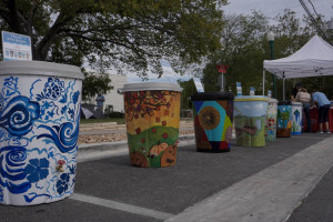 Artists painted rain barrels for the Painted Rain Barrel Project at Georgetown's South Main Arts Festival in Georgetown, Texas, on Oct. 21, 2023, (Mariela Villela/Reporting Texas TV)