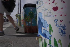 Artists painted rain barrels for the Painted Rain Barrel Project at Georgetown's South Main Arts Festival in Georgetown, Texas, on Oct. 21, 2023, (Mariela Villela/Reporting Texas TV)