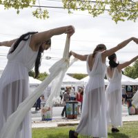Circus Picnic ribbon dancers danced to live music at Georgetown's South Main Arts Festival in Georgetown, Texas, on Oct. 21, 2023, (Mariela Villela/Reporting Texas TV)
