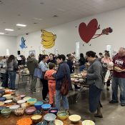 Attendees browse through thousands of bowls at the Empty Bowl Project at the Central Texas Food Bank in Austin, Texas, on Nov. 19, 2023. (Lane Rice/Reporting Texas TV)